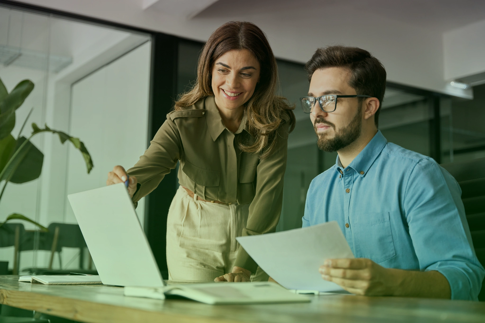 Professional consulting team strategizing business solutions in modern office environment