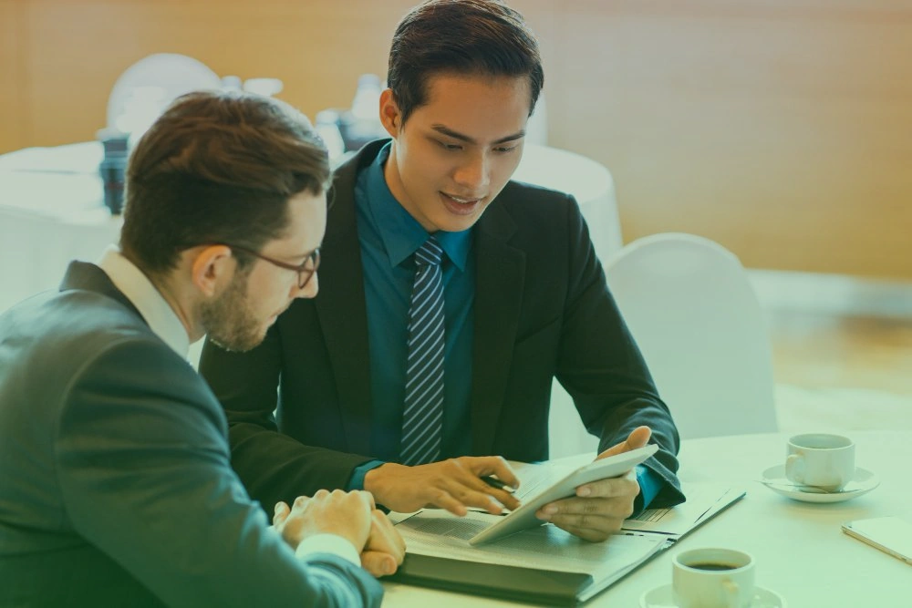 Professional consulting team in strategic planning session with business executives