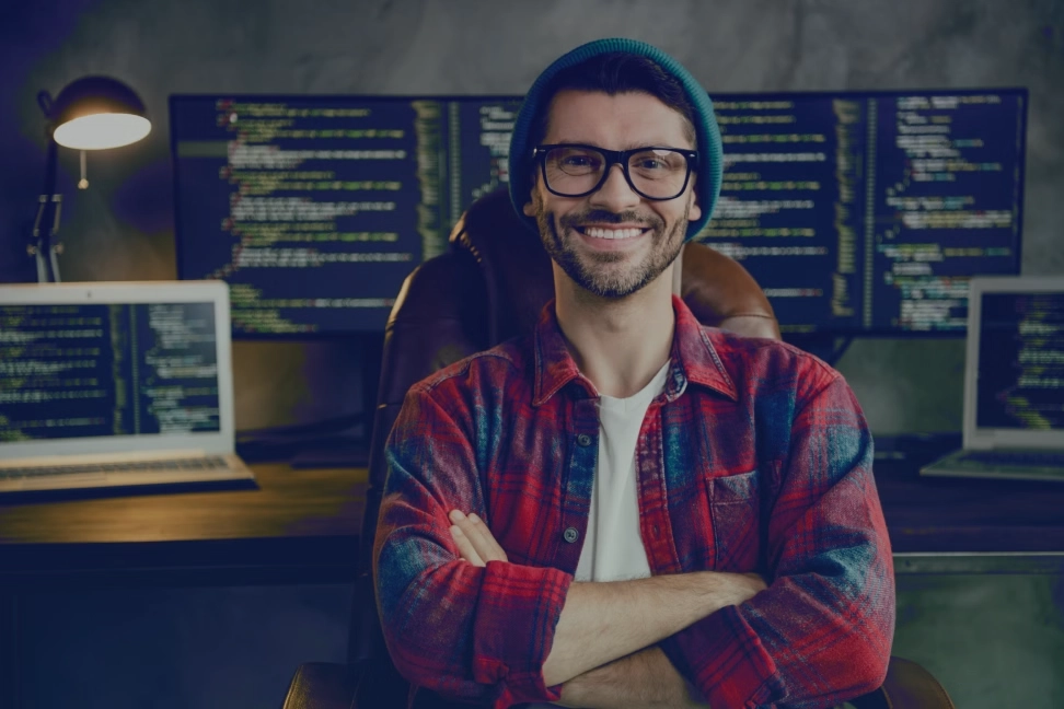 Professional web development company workspace with modern coding setup and branding elements